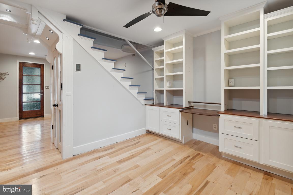 3359 Falls Road Baltimore, MD 21211 - Photo 13 of 19 Clever under-stair shelving enhances the space