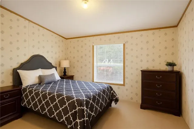 a bedroom with a bed and window