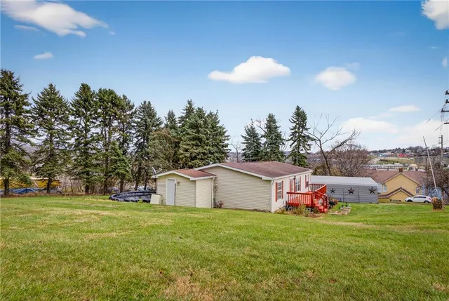 a balcony with wooden floor and outdoor seating