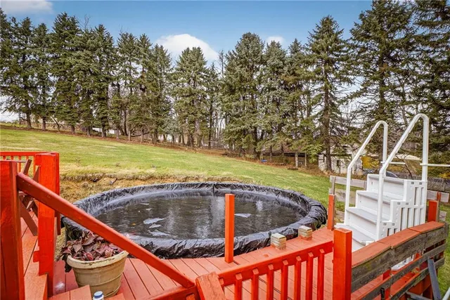 an aerial view of residential house with outdoor space and swimming pool