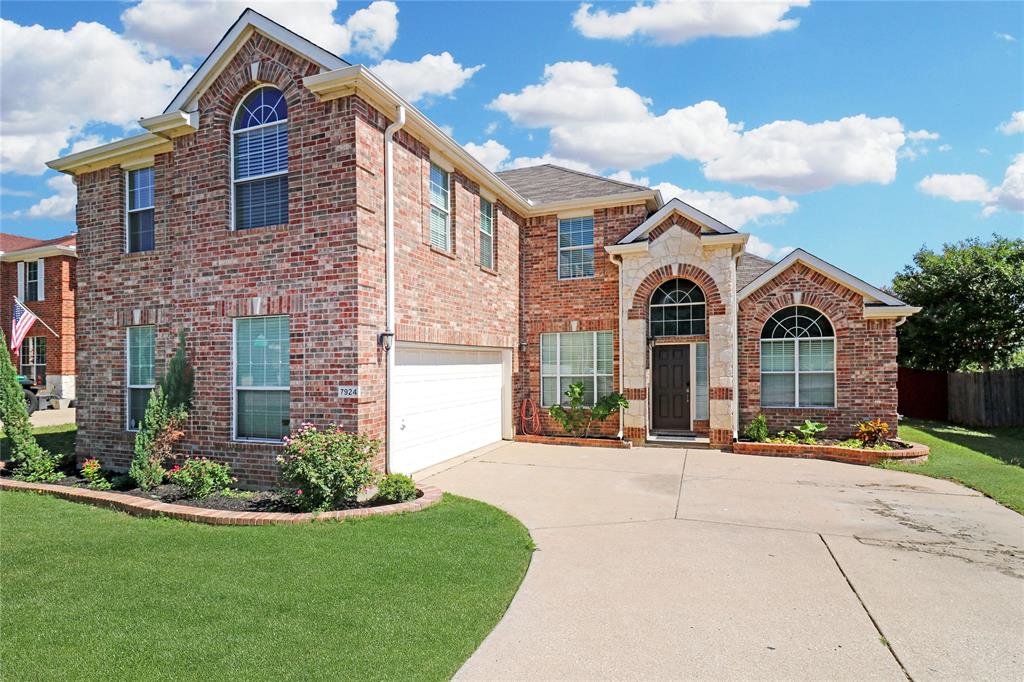7924 Rampston Place Fort Worth, TX 76137 - Photo 1 of 1 a front view of a house with yard and green space