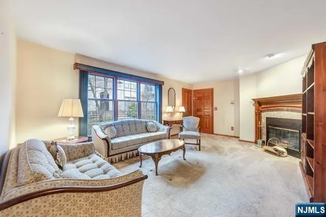 a view of a livingroom with furniture and staircase