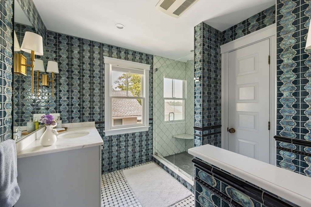 67 Hampton Circle Hull, MA 02045 - Photo 11 of 30 a bathroom with a sink a toilet and shower