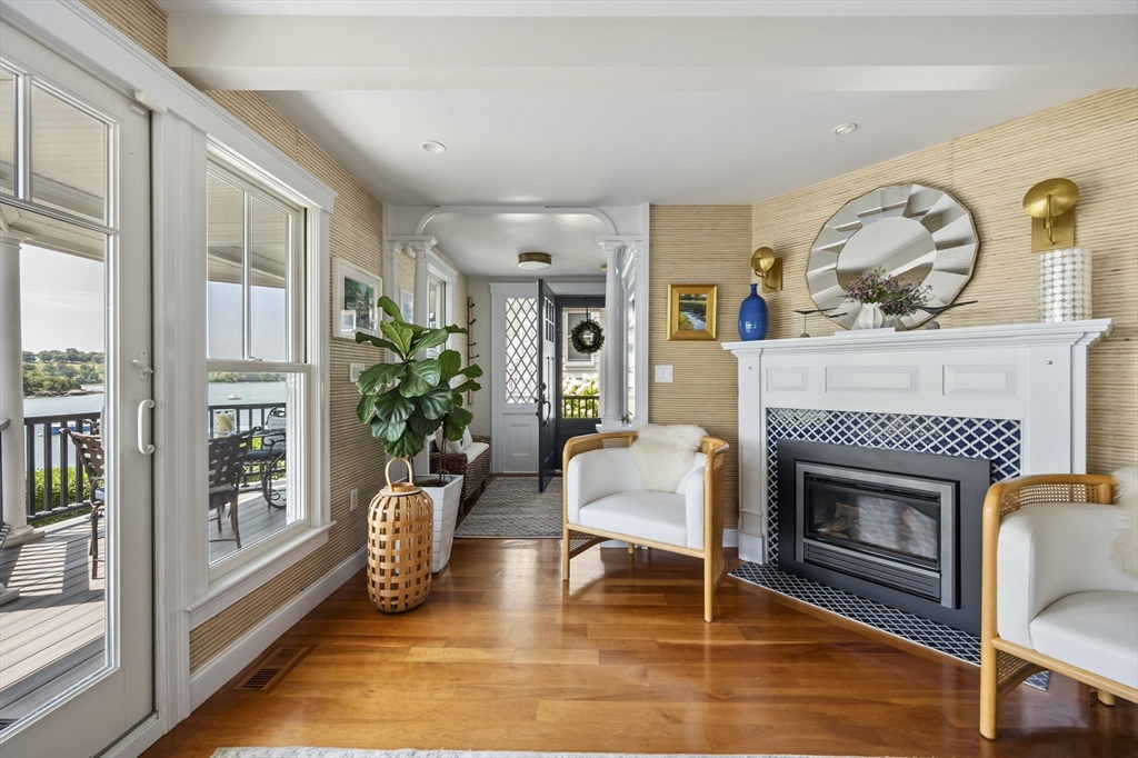 67 Hampton Circle Hull, MA 02045 - Photo 4 of 30 a living room with furniture and a fireplace