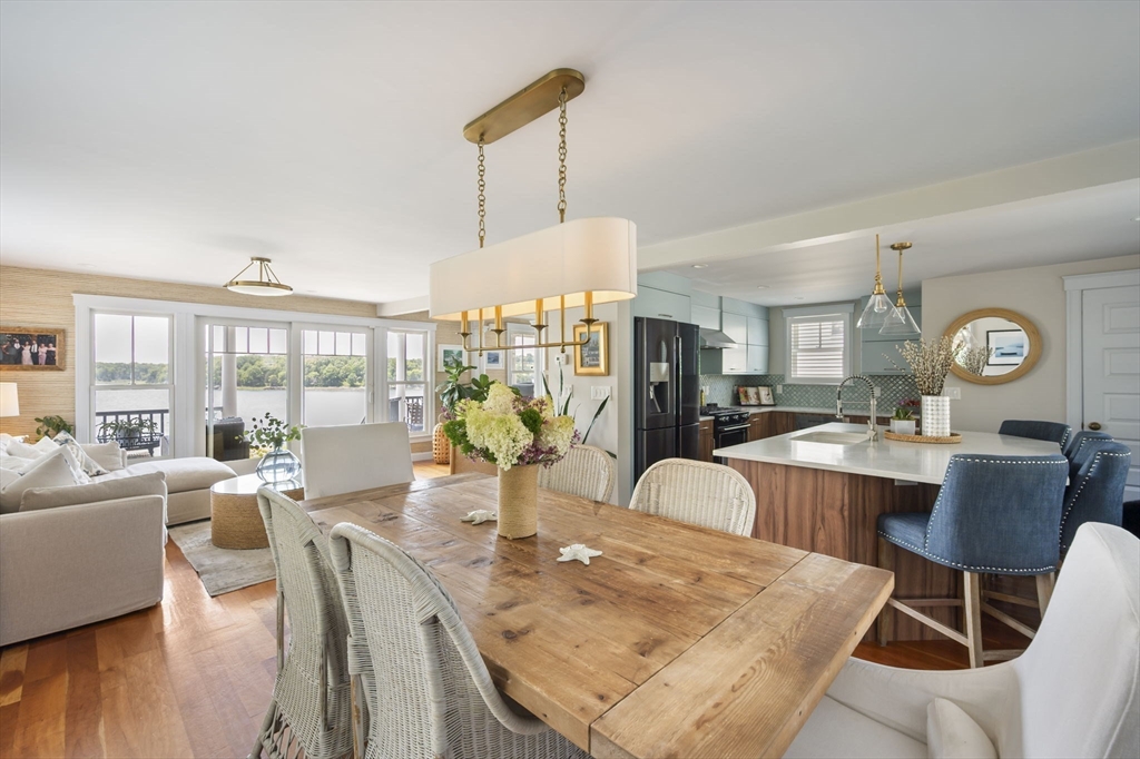 67 Hampton Circle Hull, MA 02045 - Photo 5 of 30 a view of a dining room with furniture window and wooden floor