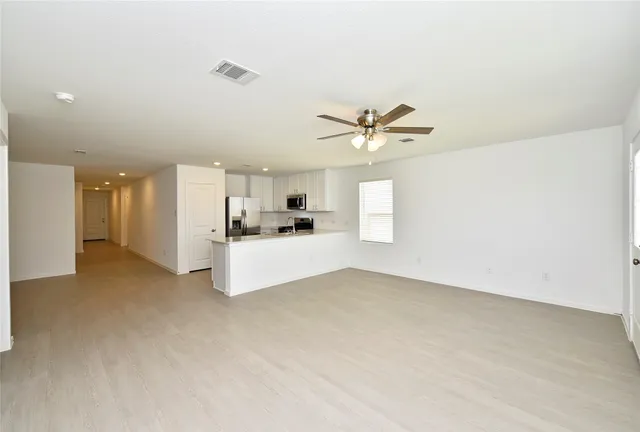 a view of a kitchen with a sink