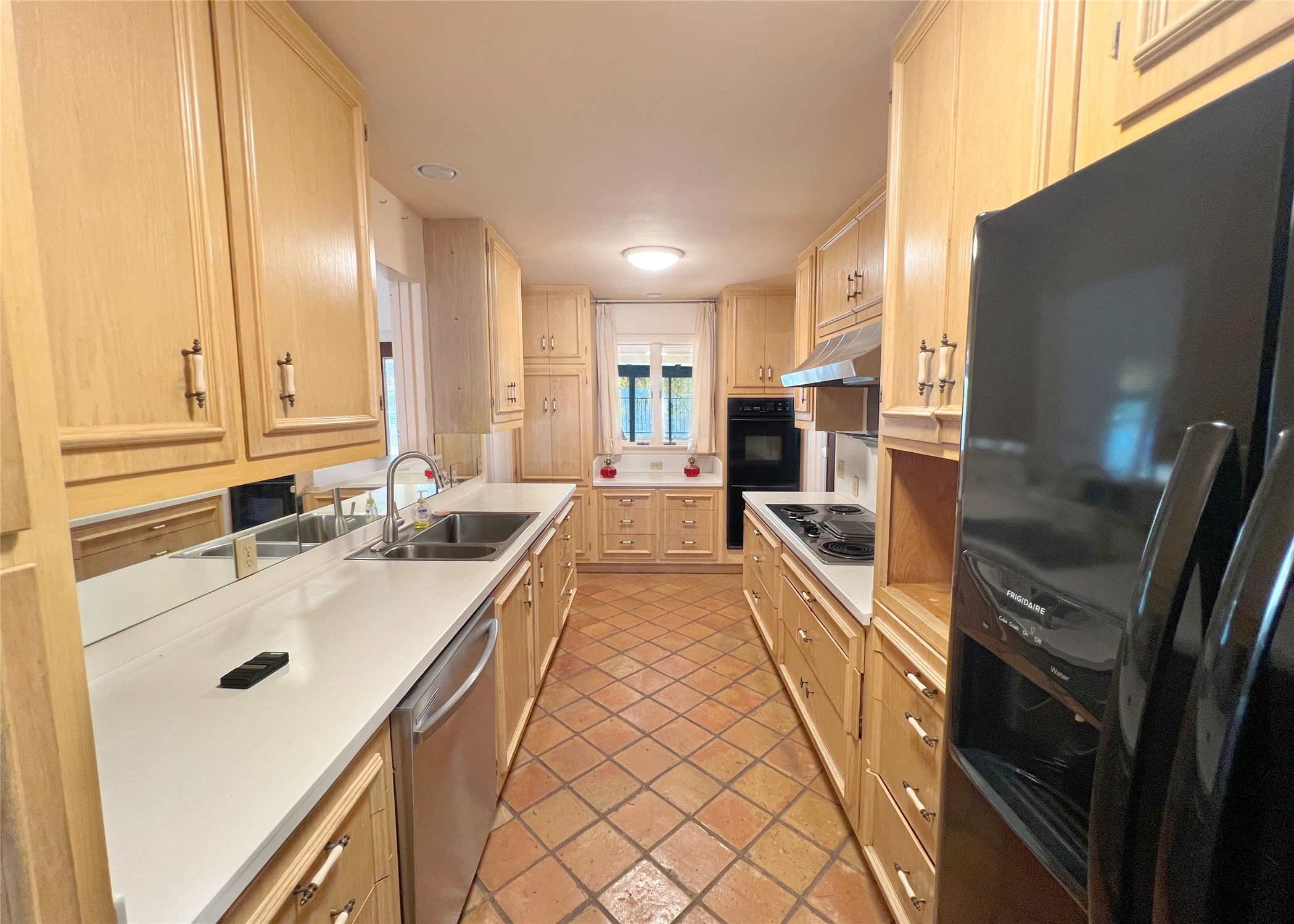 1700 Lakeshore Drive Austin, TX 78746 - Photo 20 of 26 Let your imagination run wild and open this kitchen to the adjoining Fam. Rm!