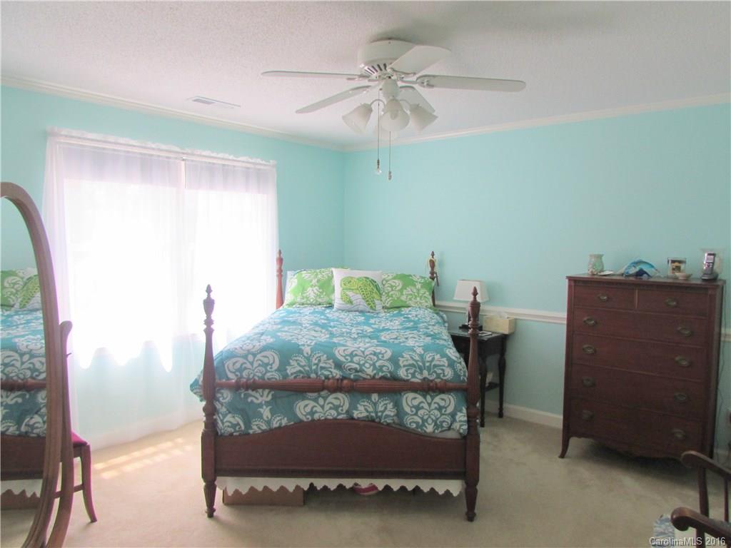1515 Mallard Bay Road York, SC 29745 - Photo 16 of 24 a bedroom with a bed and a table