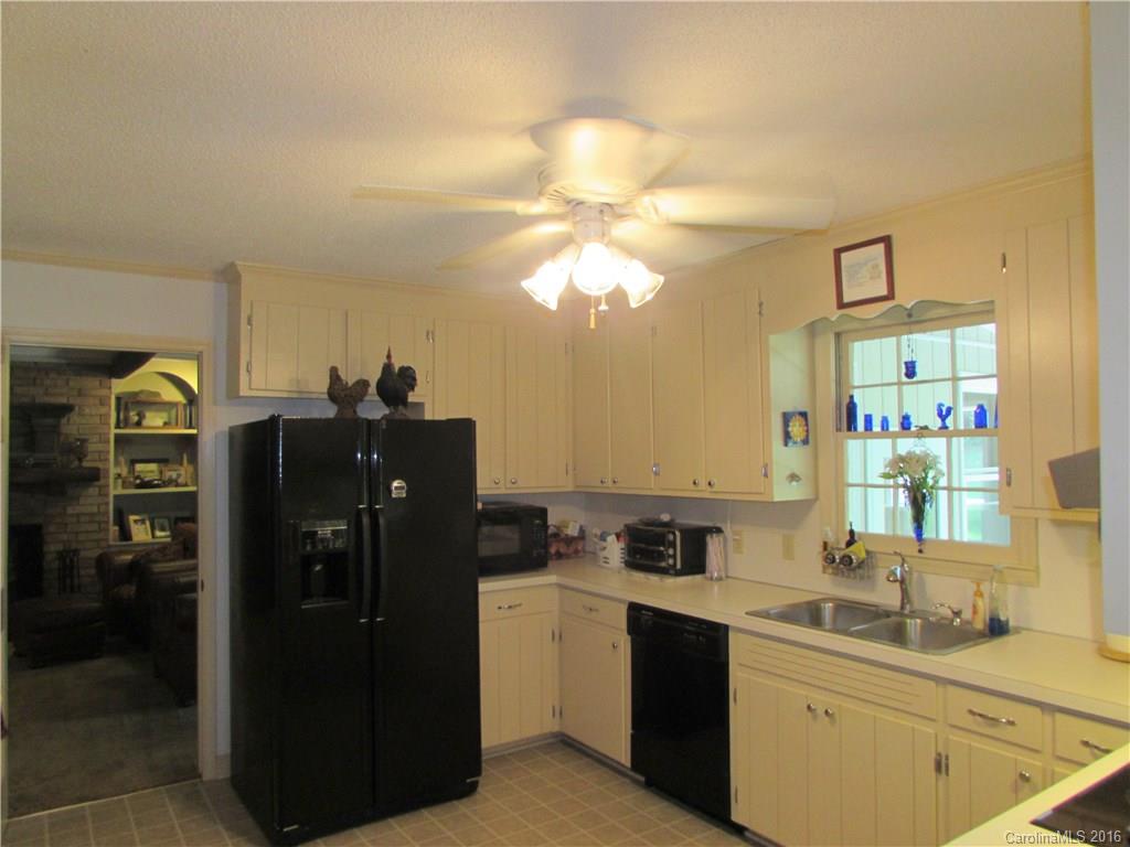 1515 Mallard Bay Road York, SC 29745 - Photo 5 of 24 a kitchen with a refrigerator and a sink