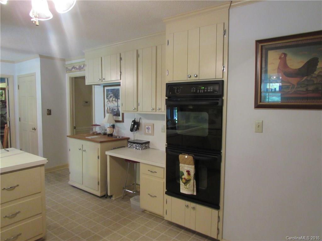1515 Mallard Bay Road York, SC 29745 - Photo 6 of 24 a kitchen with stainless steel appliances granite countertop a refrigerator stove and sink