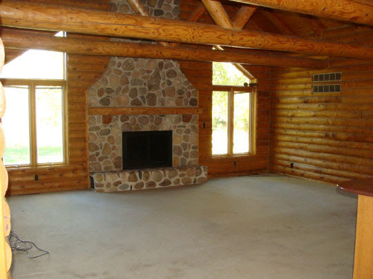 20813 Streit Road Harvard, IL 60033 - Photo 3 of 11 a view of an empty room with a fireplace and a window
