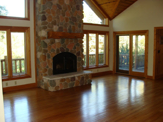 20813 Streit Road Harvard, IL 60033 - Photo 7 of 11 a living room with a fireplace and wooden floor