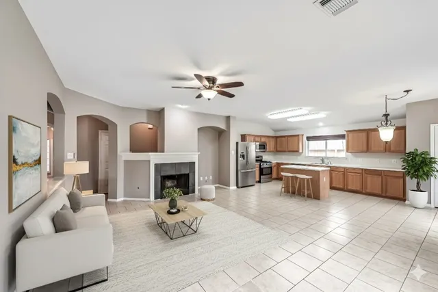 a view of living room with furniture and fireplace