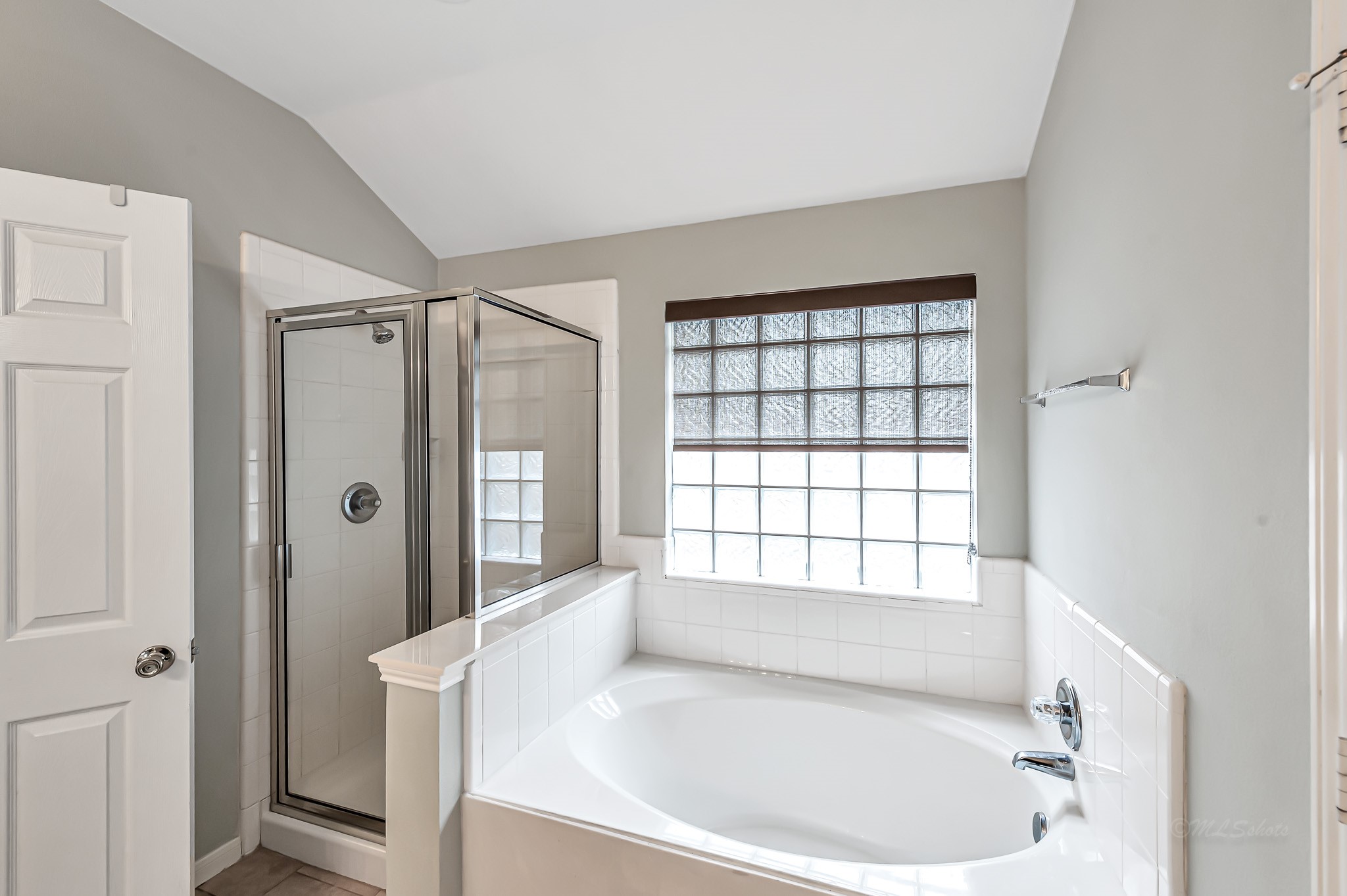 1602 Rustic Hollow Lane Katy, TX 77450 - Photo 23 of 48 separate shower, relaxing soaking tub with glass-block window for natural light.