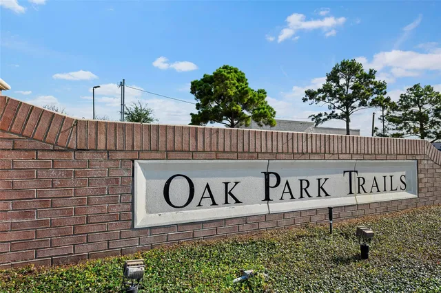 an aerial view of a house with swimming pool garden and patio