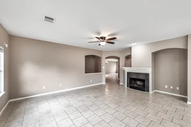 a large kitchen with cabinets and stainless steel appliances