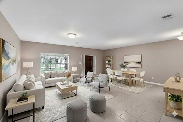 a living room with furniture and a large window