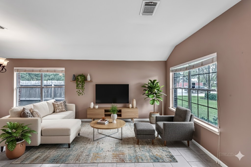 1602 Rustic Hollow Lane Katy, TX 77450 - Photo 8 of 48 Spacious living area with wide windows overlooking the backyard and front lawn.