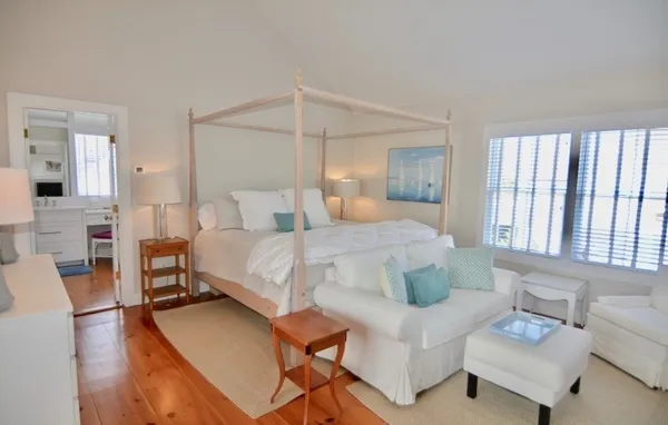 a bedroom with a bed and a couch