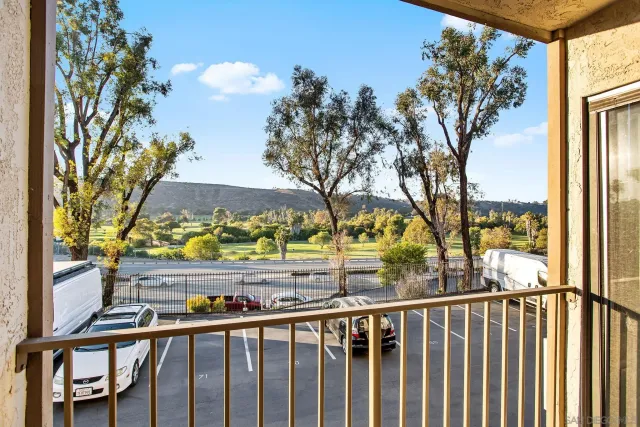 a view of a balcony with chairs