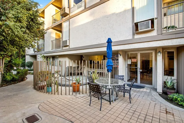 a view of a building with sitting area