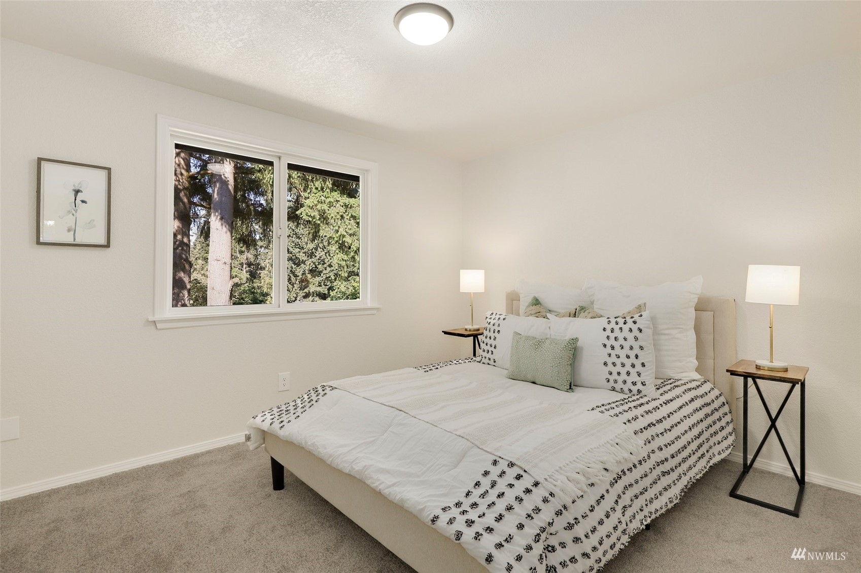 22019 2nd Place West Bothell, WA 98021 - Photo 20 of 40 a bedroom with a bed and painting on the wall