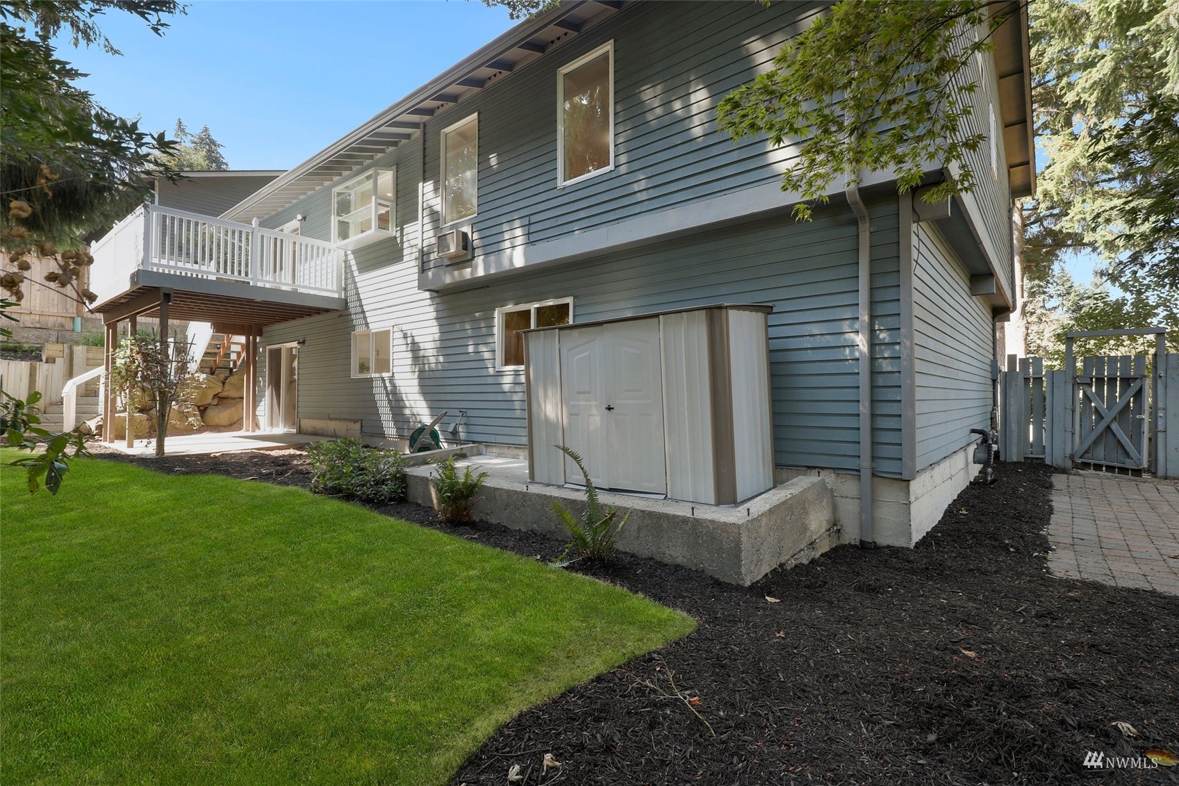 22019 2nd Place West Bothell, WA 98021 - Photo 34 of 40 a view of a white house with a yard and stairs