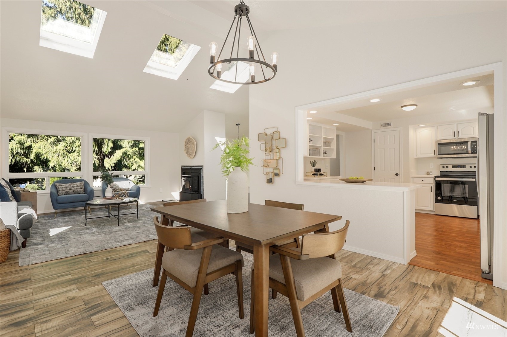 22019 2nd Place West Bothell, WA 98021 - Photo 7 of 40 a view of a dining room with furniture window and wooden floor