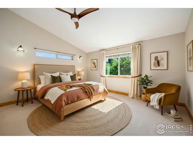 a bathroom with a granite countertop sink a toilet a mirror and bathtub
