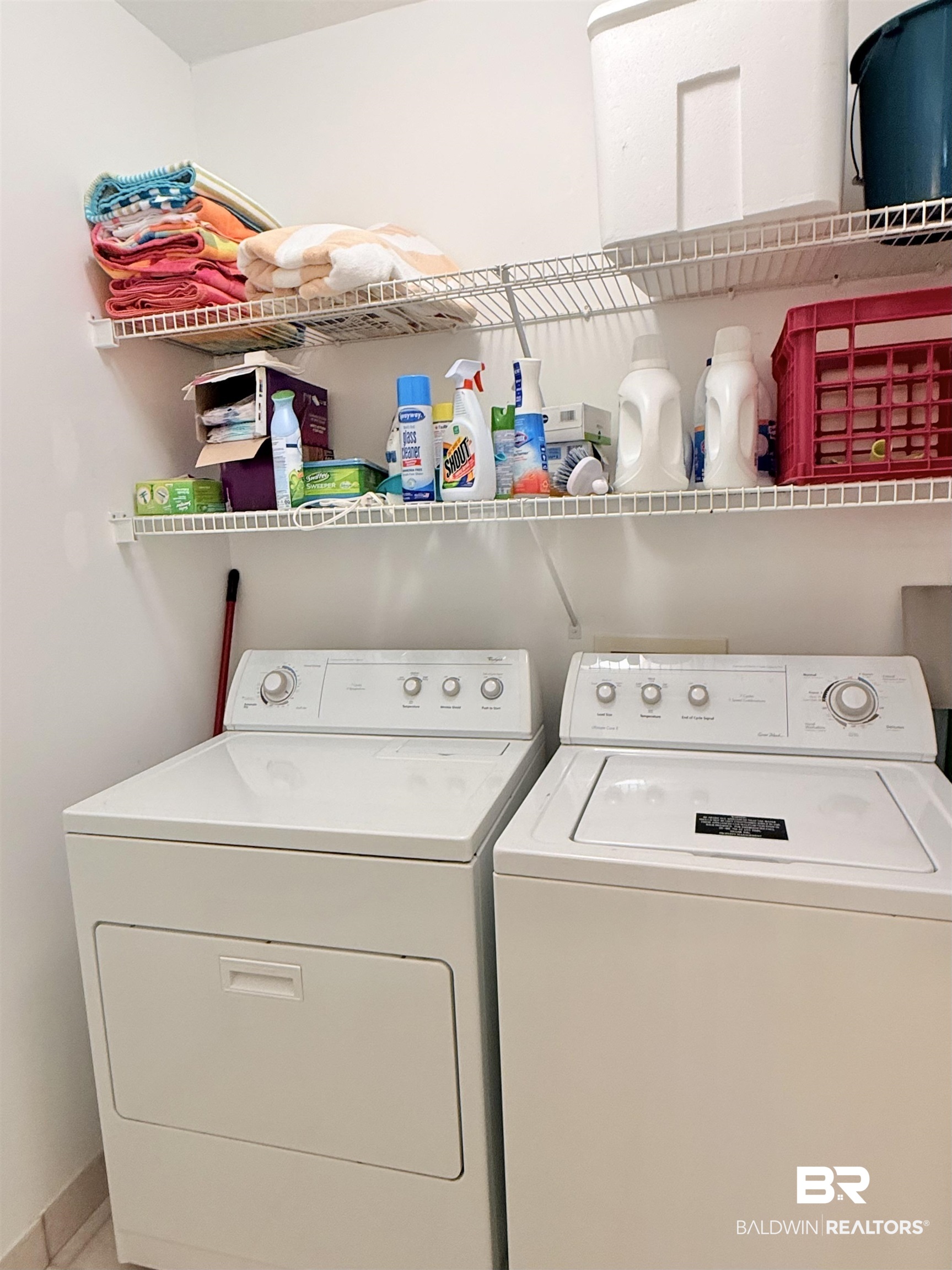 27284 Gulf Road, Unit 212 Orange Beach, AL 36561 - Photo 24 of 35 Laundry area featuring independent washer and dryer and baseboards