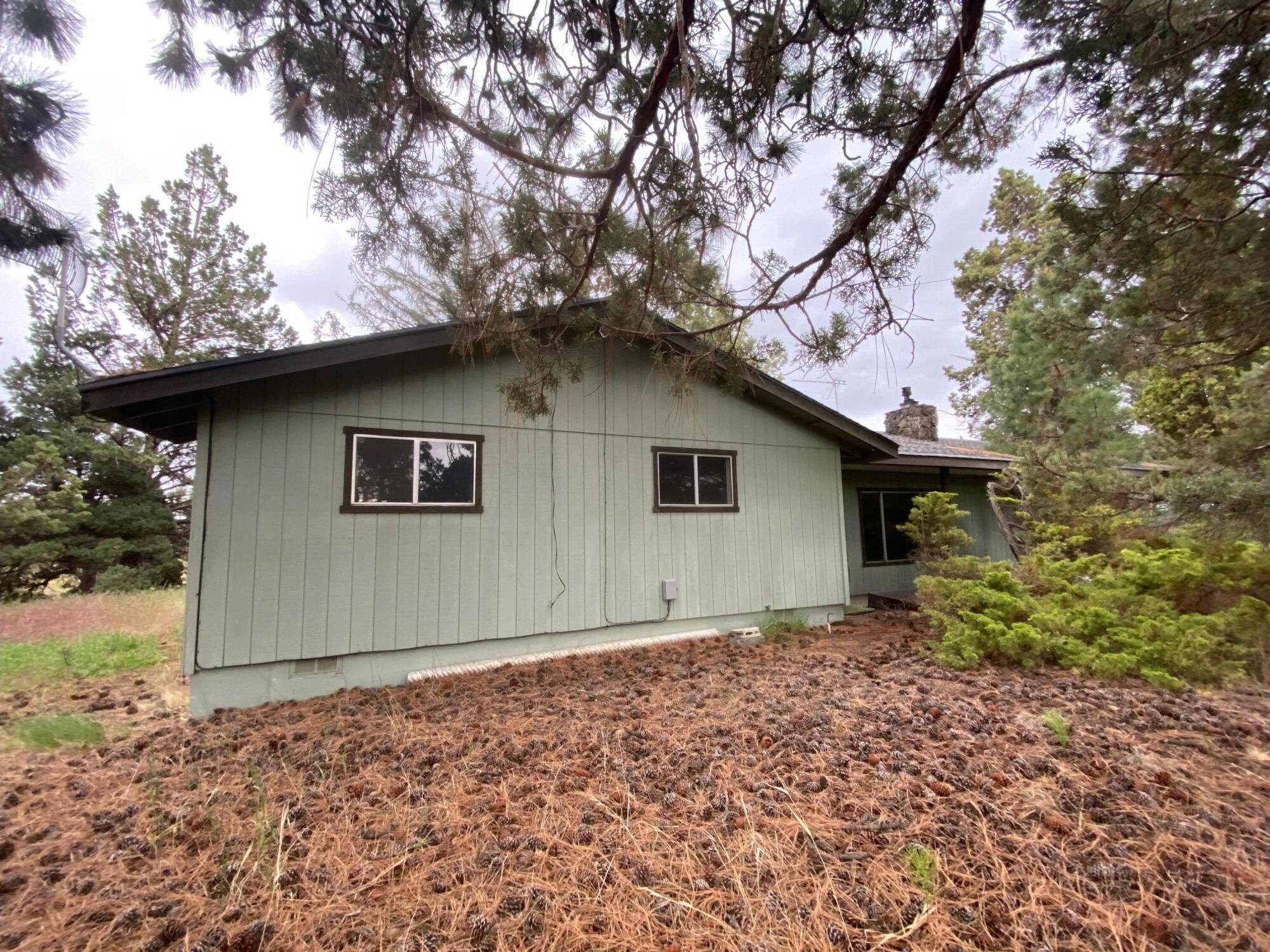 62310 Byram Road Bend, OR 97701 - Photo 11 of 21 a house with a tree in the background