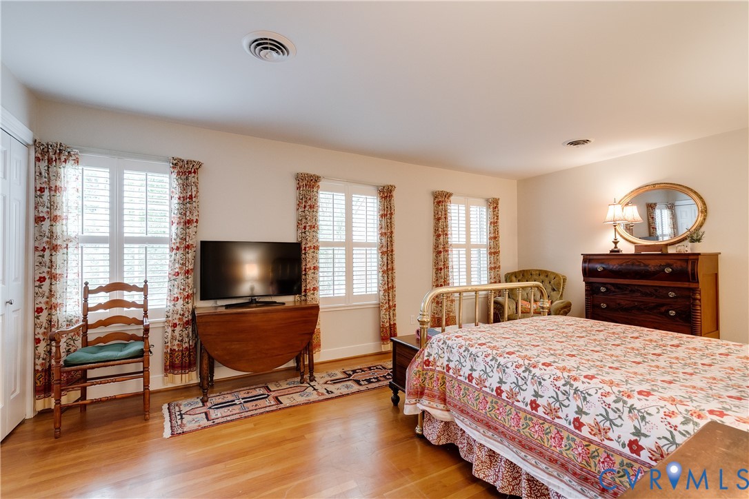 300 North Ridge Road, Unit 45 Henrico, VA 23229 - Photo 19 of 34 Primary bedroom with 3 windows