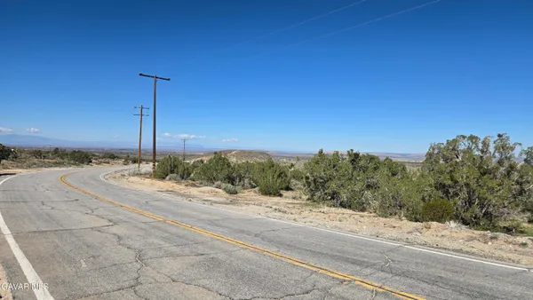 a view of a road with a building in the background