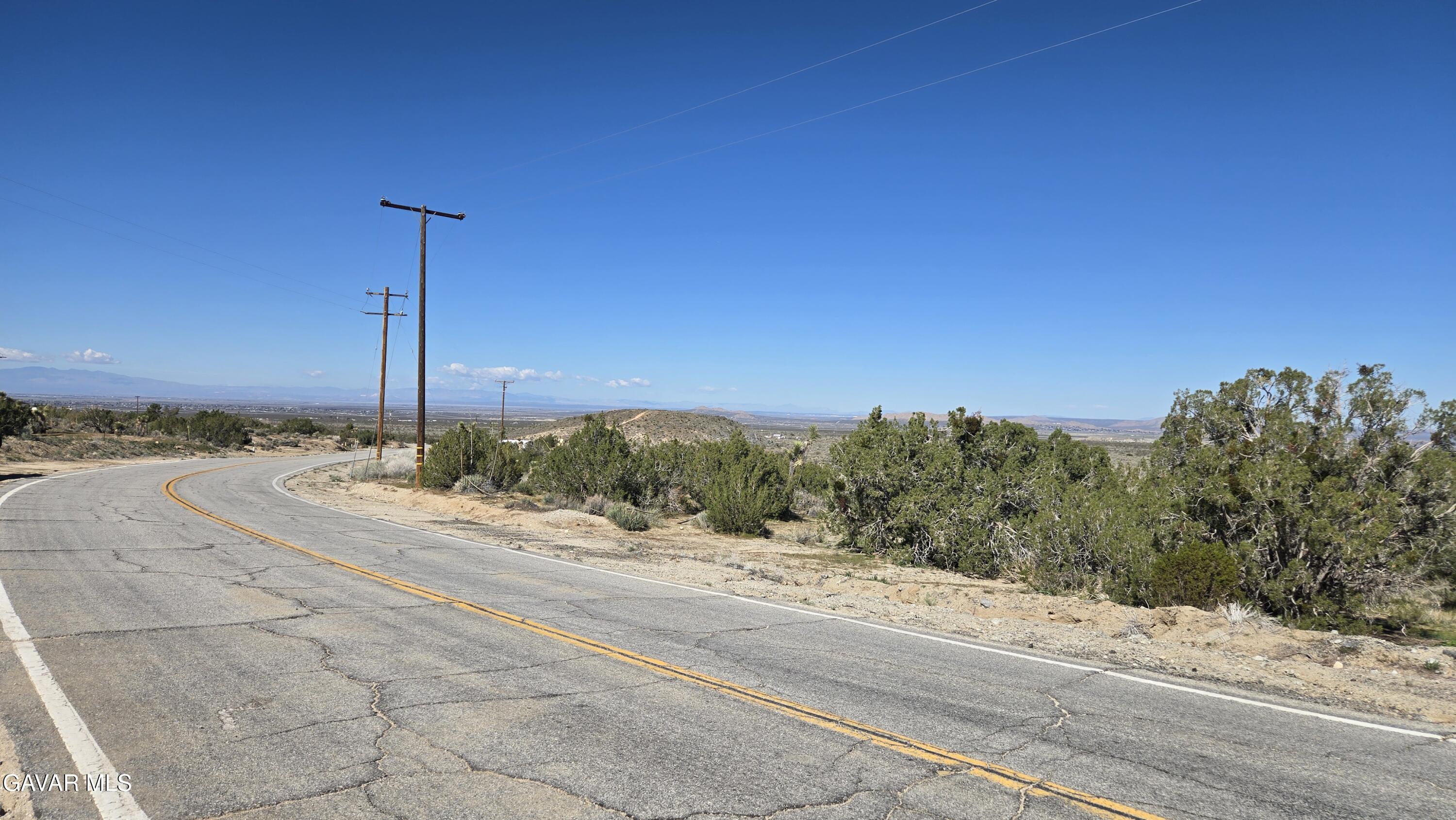 Valyermo Road Pearblossom, CA 93553 - Photo 11 of 34 a view of a road with a building in the background