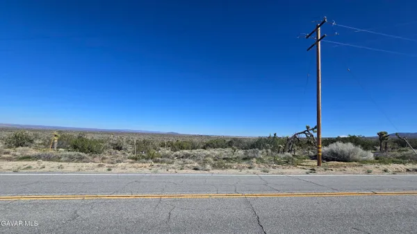 a view of a road with an ocean view