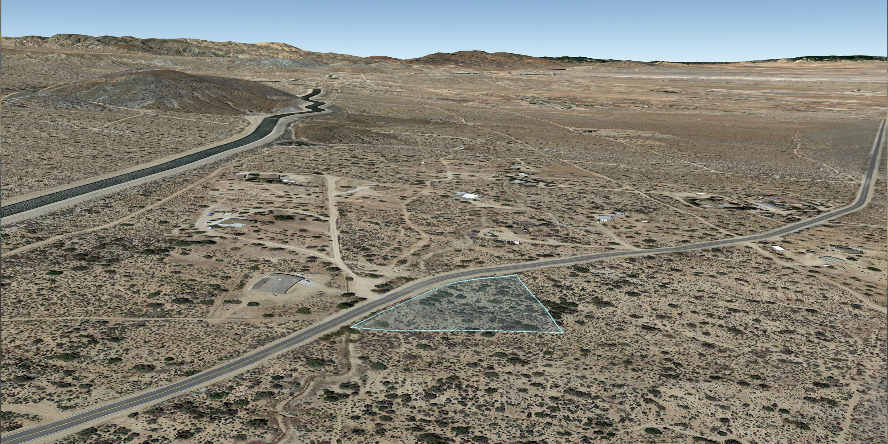 Valyermo Road Pearblossom, CA 93553 - Photo 31 of 34 a view of a dry yard with mountains in the background