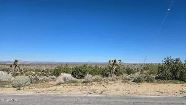 a view of a road with a ocean view