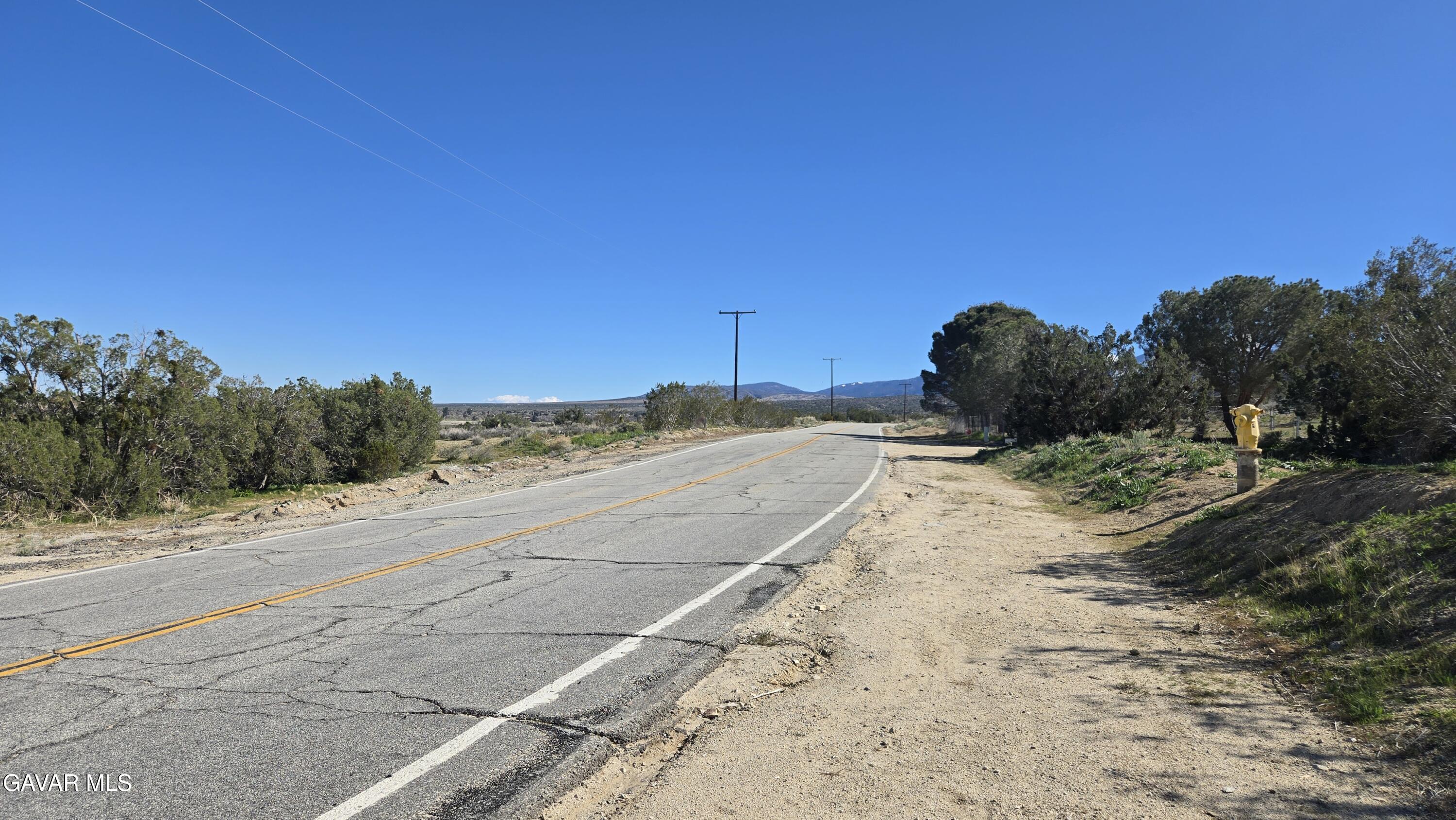 Valyermo Road Pearblossom, CA 93553 - Photo 9 of 34 a view of a road with a building in the background