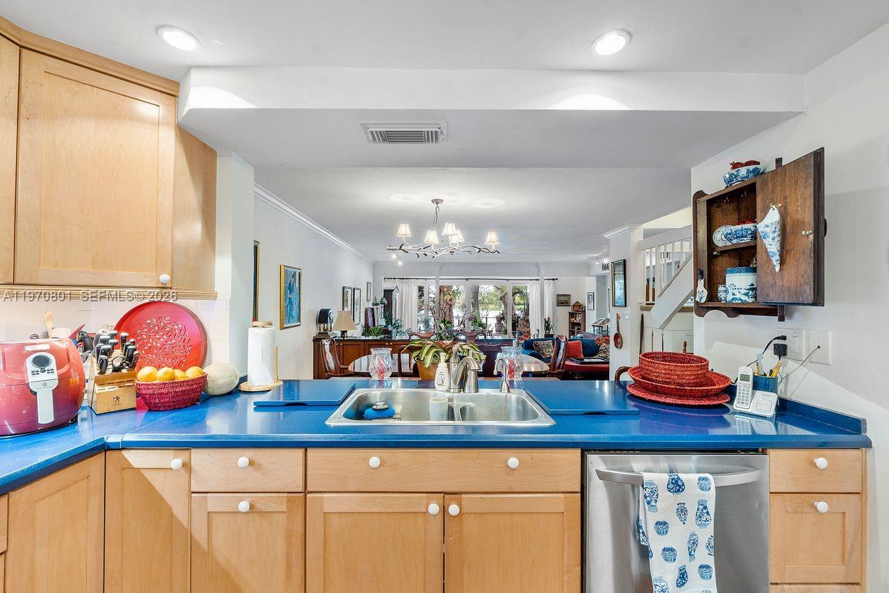 4905 Southwest 71st Place Miami, FL 33155 - Photo 12 of 37 a kitchen with lots of counter top space and dining table