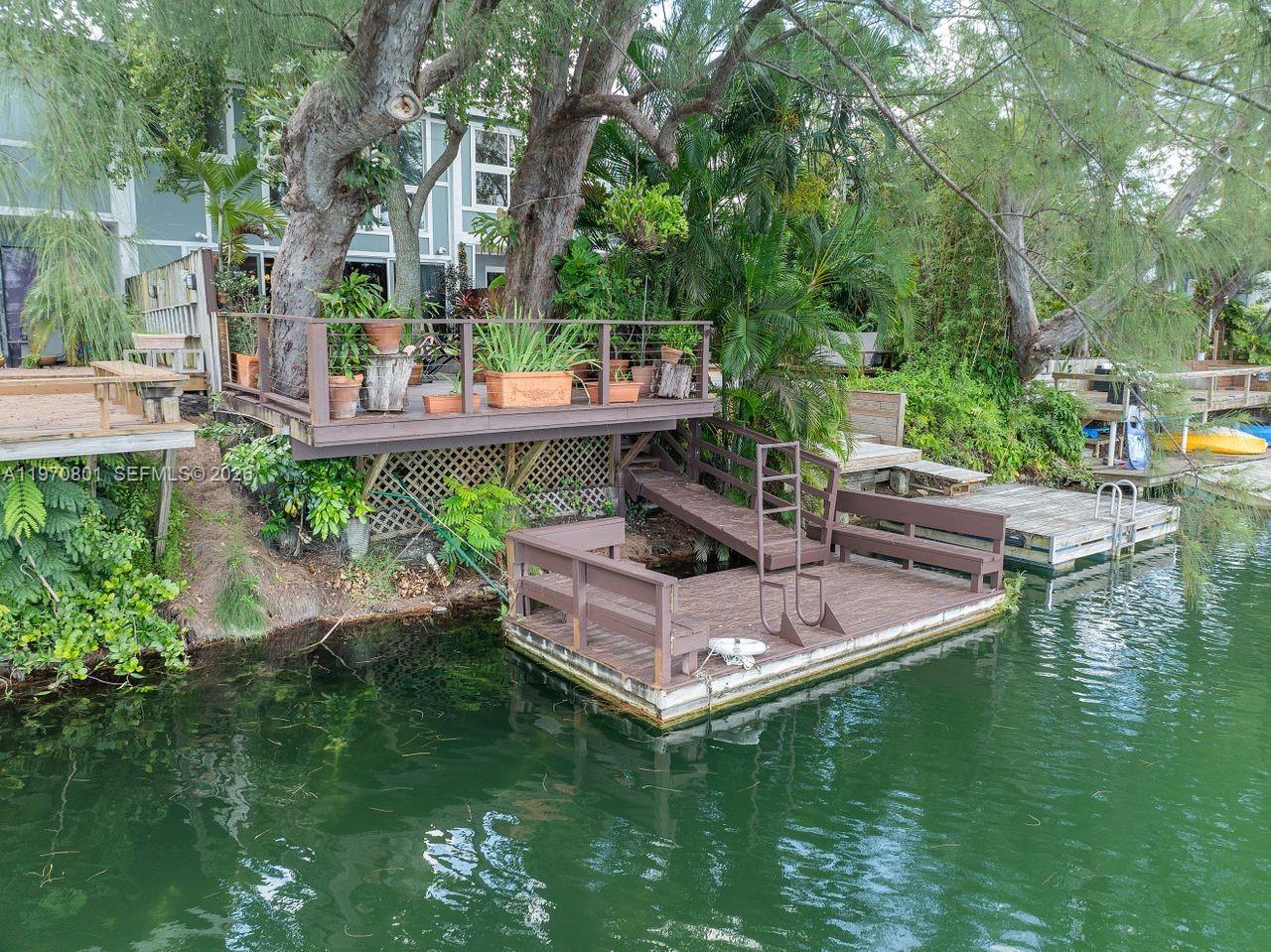 4905 Southwest 71st Place Miami, FL 33155 - Photo 2 of 37 a view of swimming pool with lawn chairs and plants