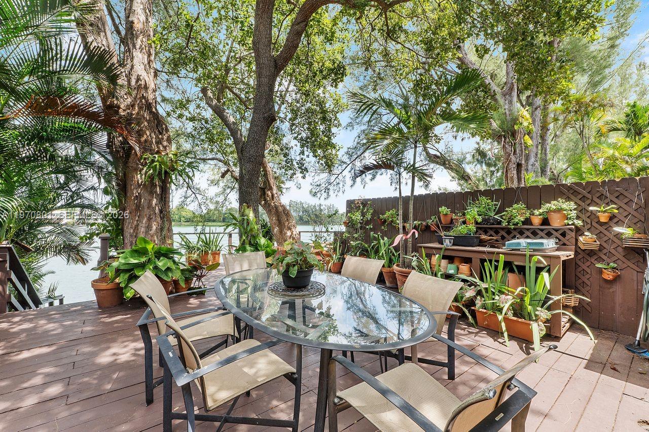 4905 Southwest 71st Place Miami, FL 33155 - Photo 26 of 37 a view of chairs and tables in a patio