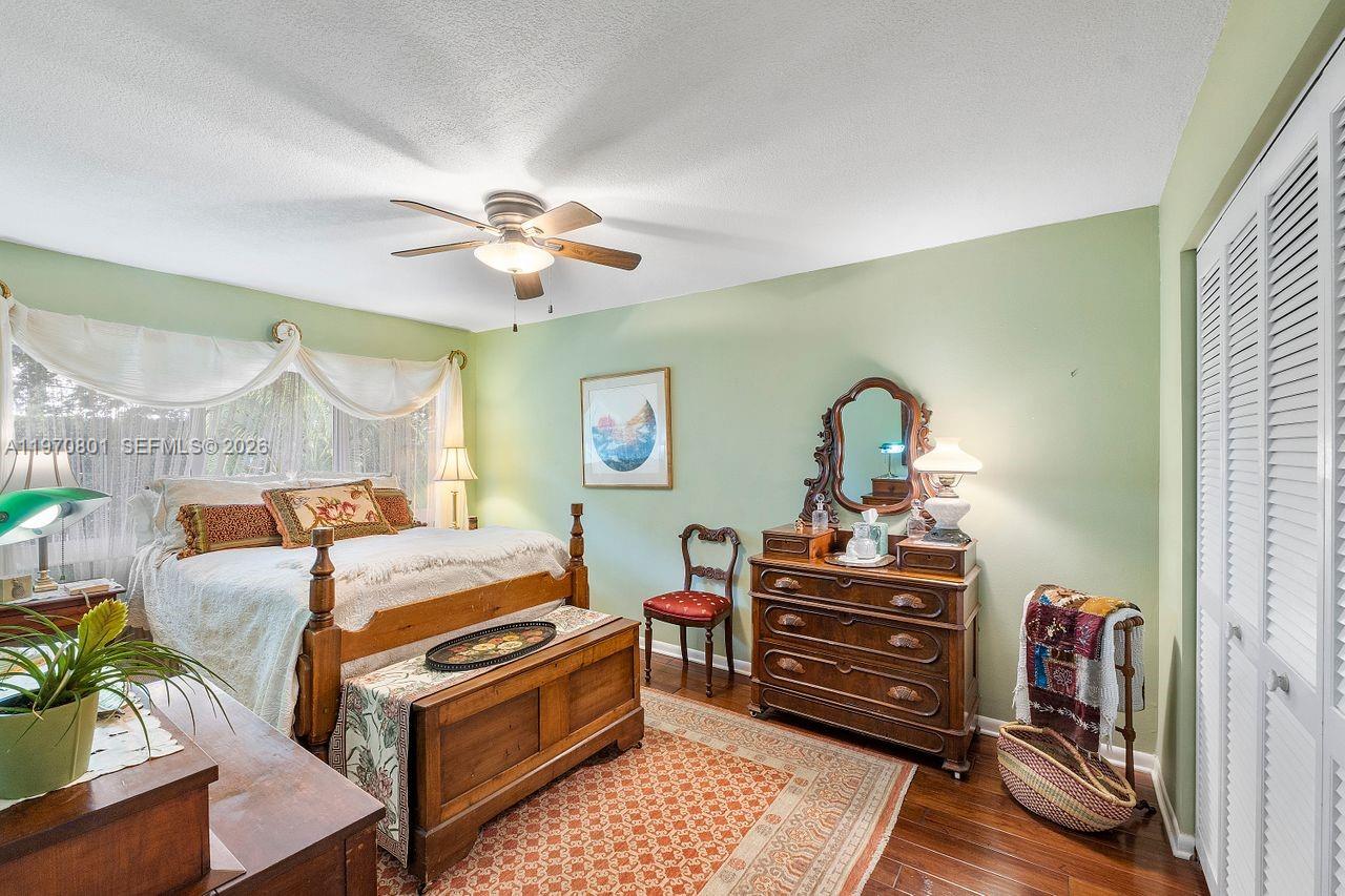 4905 Southwest 71st Place Miami, FL 33155 - Photo 28 of 37 a bedroom with furniture and a dresser