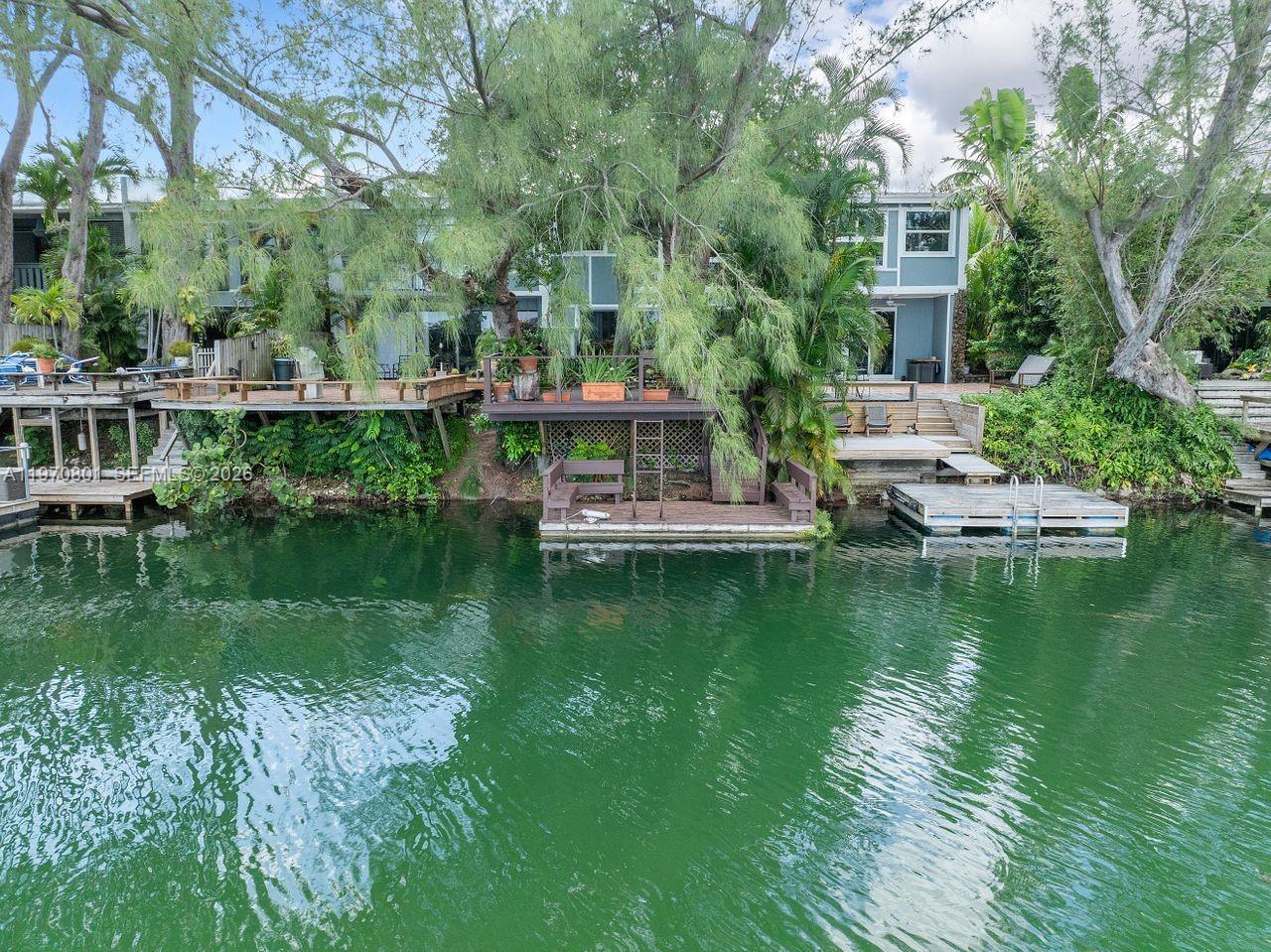 4905 Southwest 71st Place Miami, FL 33155 - Photo 34 of 37 a view of residential house with outdoor space and lake view