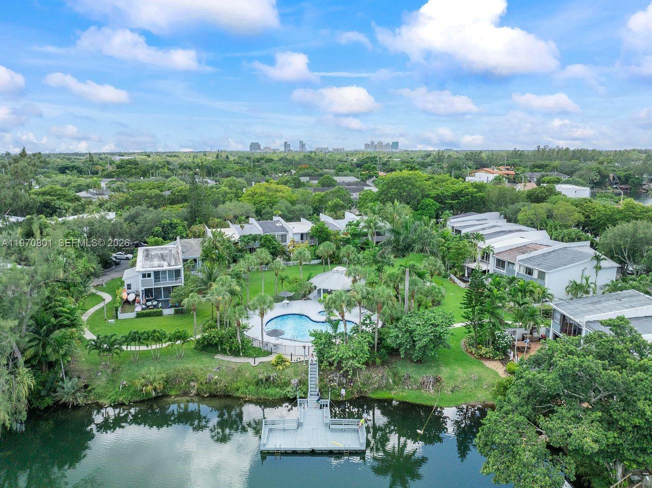 4905 Southwest 71st Place Miami, FL 33155 - Photo 36 of 37 a view of a garden with a building in the background