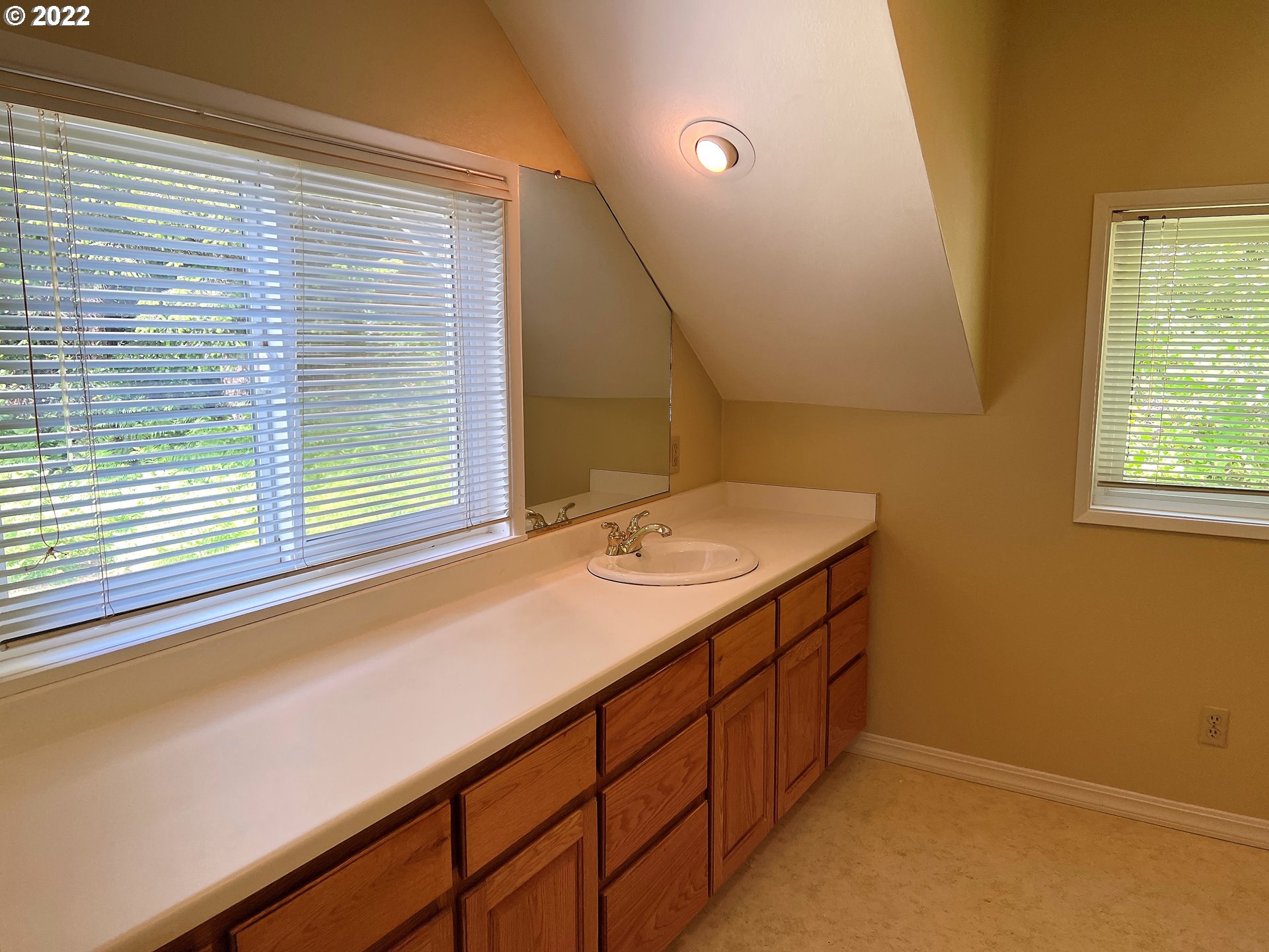 96068 Sundown Road Brookings, OR 97415 - Photo 13 of 31 a bathroom with a sink and a window