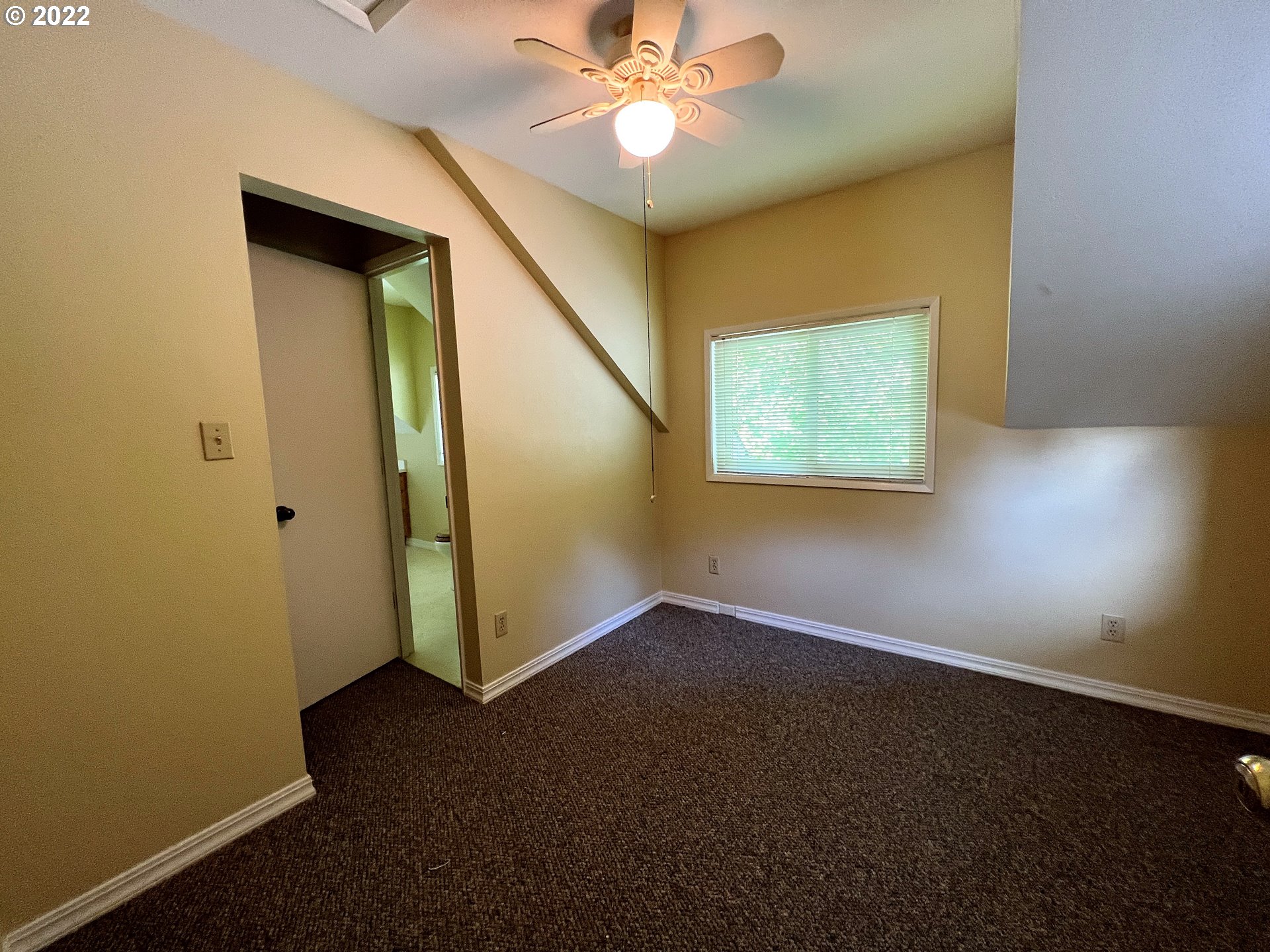 96068 Sundown Road Brookings, OR 97415 - Photo 15 of 31 an empty room with windows and fan