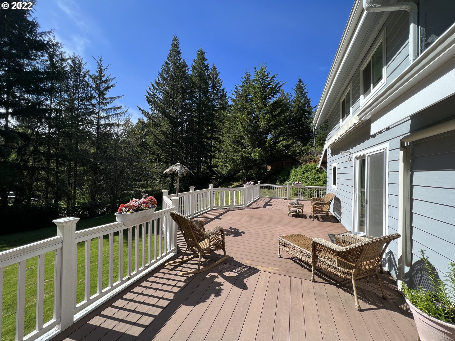 96068 Sundown Road Brookings, OR 97415 - Photo 24 of 31 a view of a patio with two chairs and a table