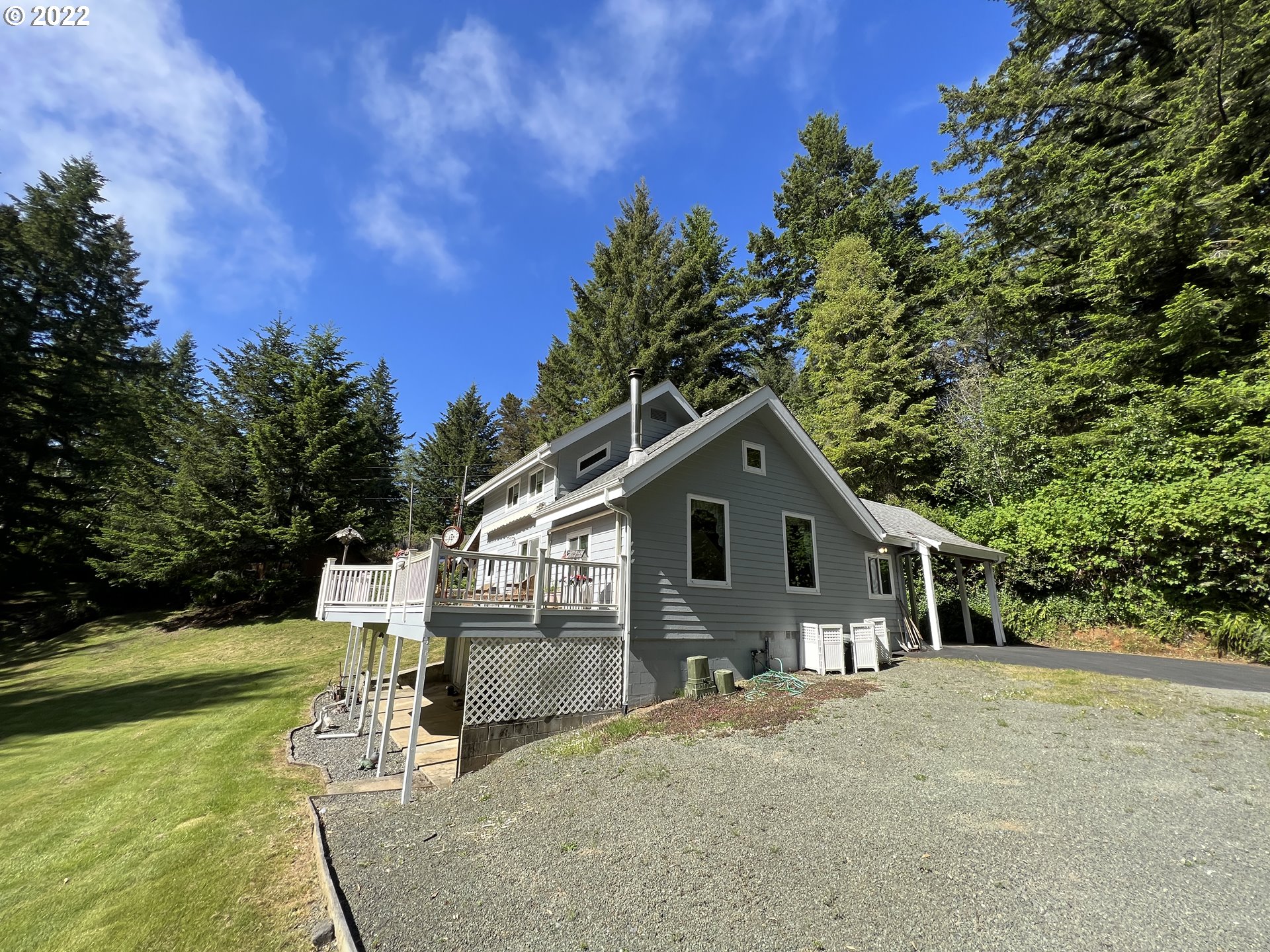 96068 Sundown Road Brookings, OR 97415 - Photo 26 of 31 a view of a house with a yard