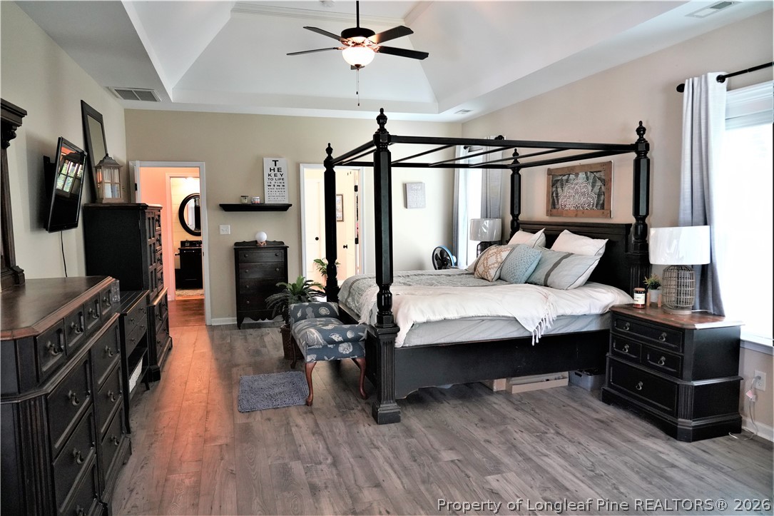 930 Old Vander Road Fayetteville, NC 28312 - Photo 24 of 45 a bedroom with a bed a flat screen tv and dresser