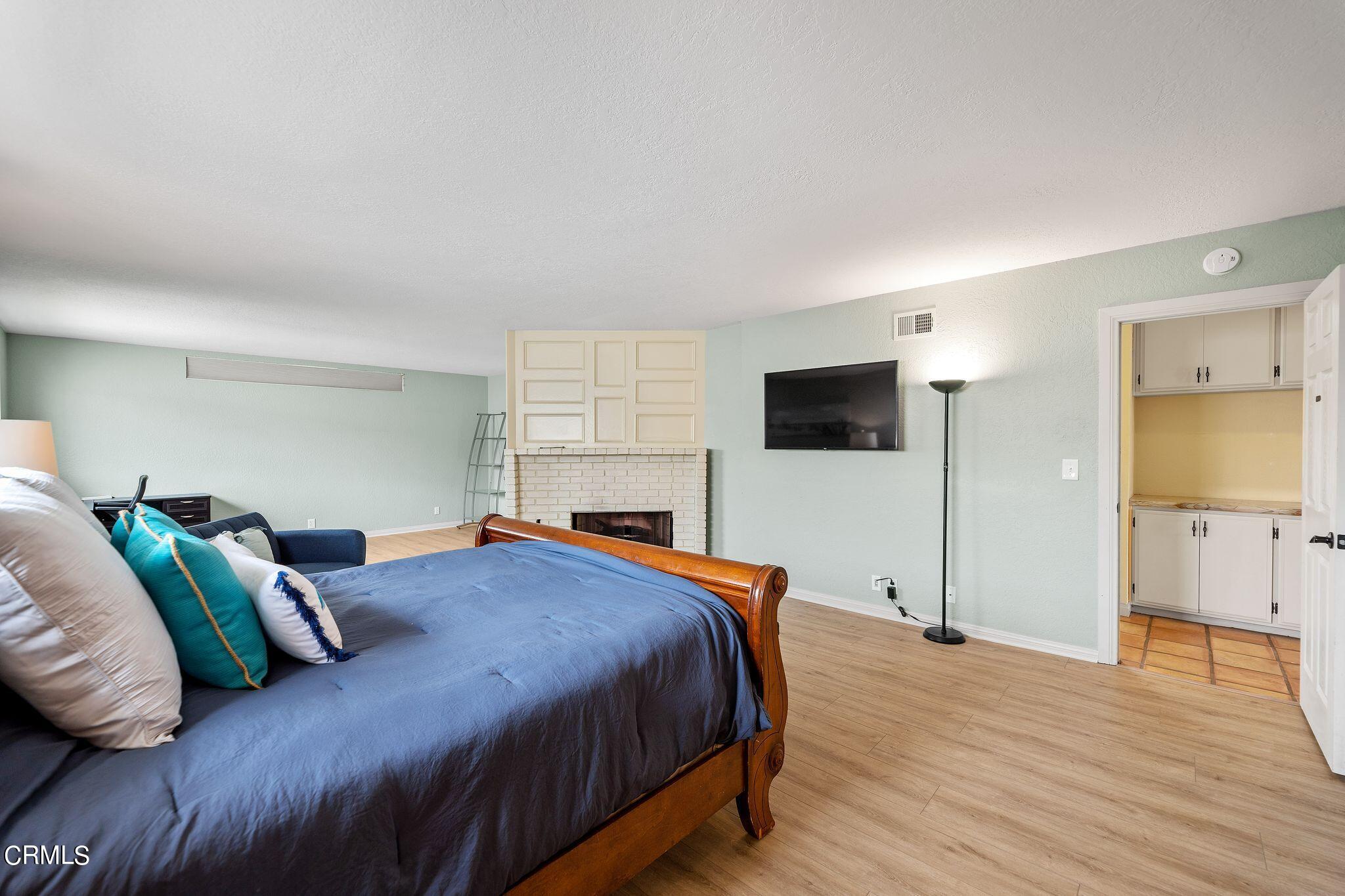 4850 Amalfi Way Oxnard, CA 93035 - Photo 26 of 51 a bedroom with a bed and a flat screen tv